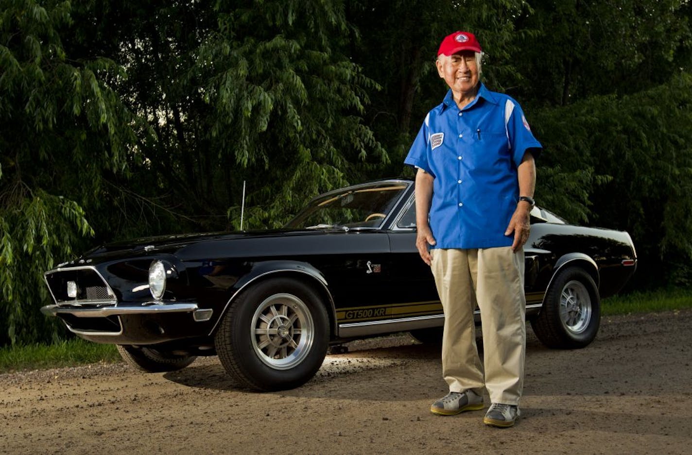 John Chun stood next to a 1968 Shelby Mustang GT 500 KR owned by Dan Mattila. Chun helped design the 1967-69 Shelby Mustangs.