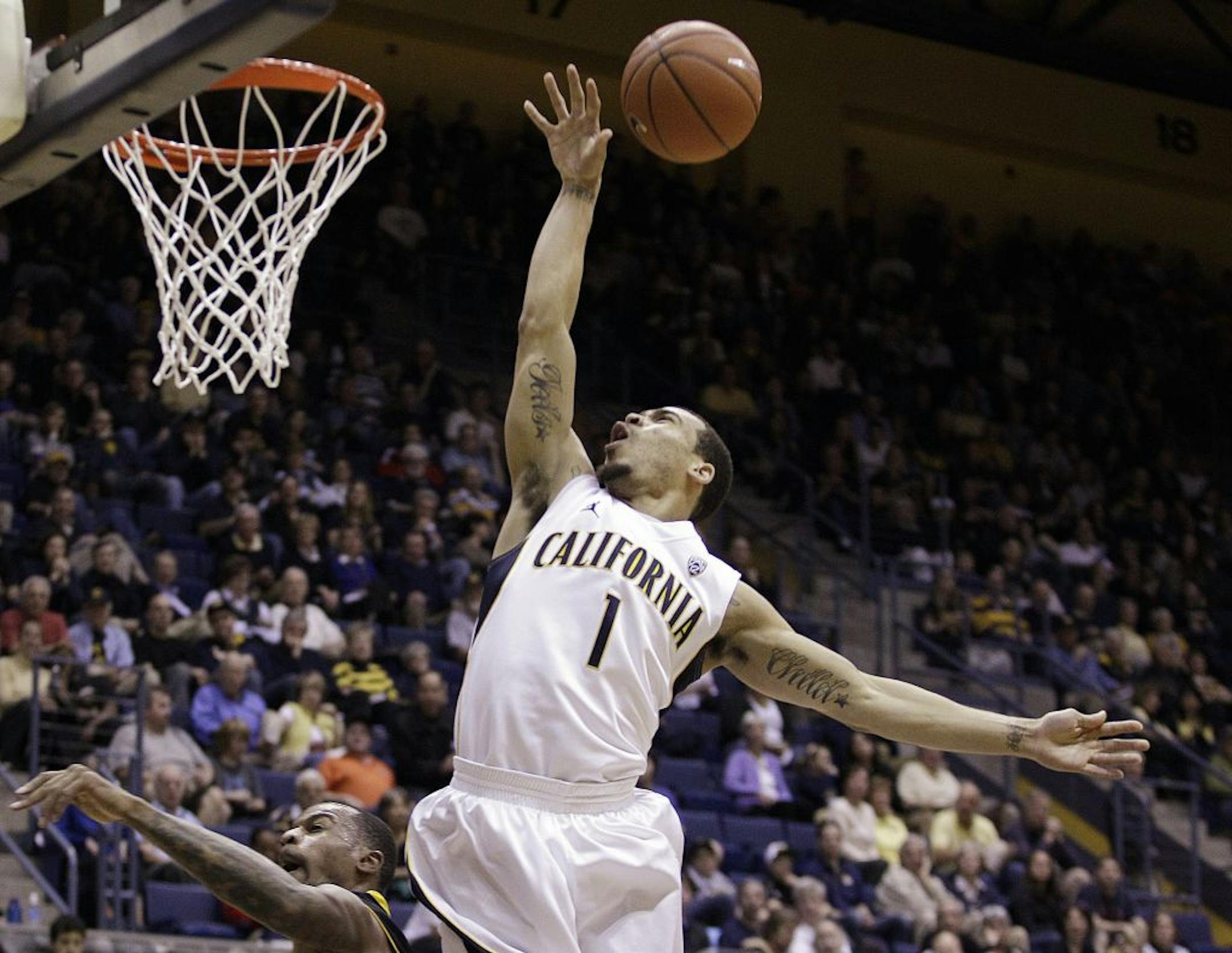 California's Justin Cobbs (1) shoots over Arizona State's Kyle Cain during the second half of an NCAA college basketball game on Saturday, Feb. 4, 2012, in Berkeley, Calif.