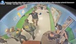 In this photo from surveillance video provided by the Uvalde Consolidated Independent School District via the Austin American-Statesman, authorities s