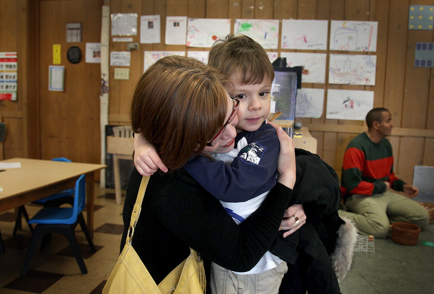 Amanda Tallen gave her son Jimmy Oscar Baca Tallen, 4, a hug goodbye after dropping his off at St. Paul's Childhood Center Tuesday, February 19, 2013. Gov. Mark Dayton has proposed boosting scholarship money for parents seeking to put their children in preschool programs from $3 million to $25 million annually. The $4,000 scholarships allow parents to place children in four-star-rated programs. In addition, the federal government has provided Race to the Top funds for the same purpose, but limit