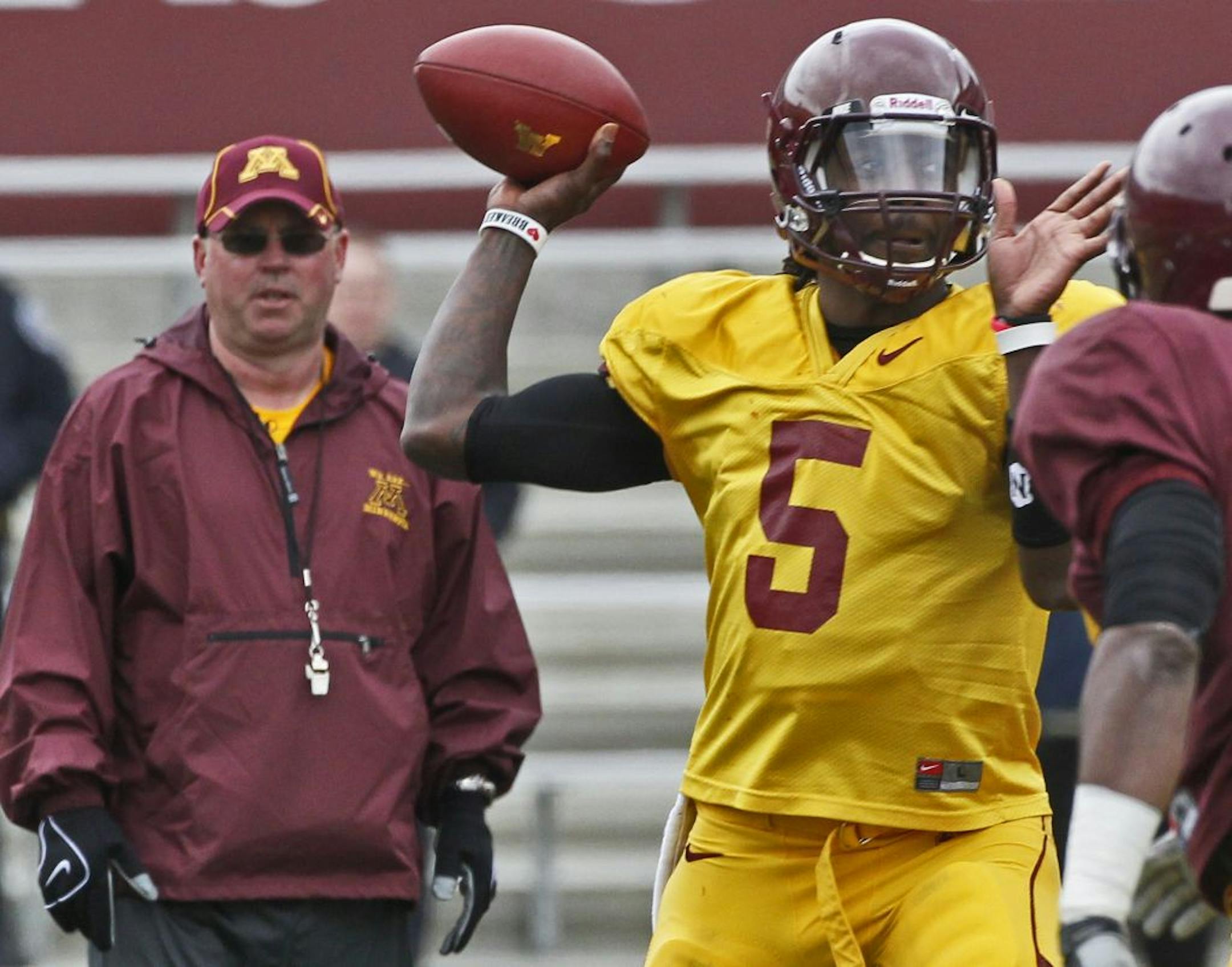 Head football coach Jerry Kill, MarQueis Gray