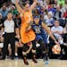Seimone Augustus (33) dribbles by the Phoenix Mercury's Diana Taurasi during a game last week.