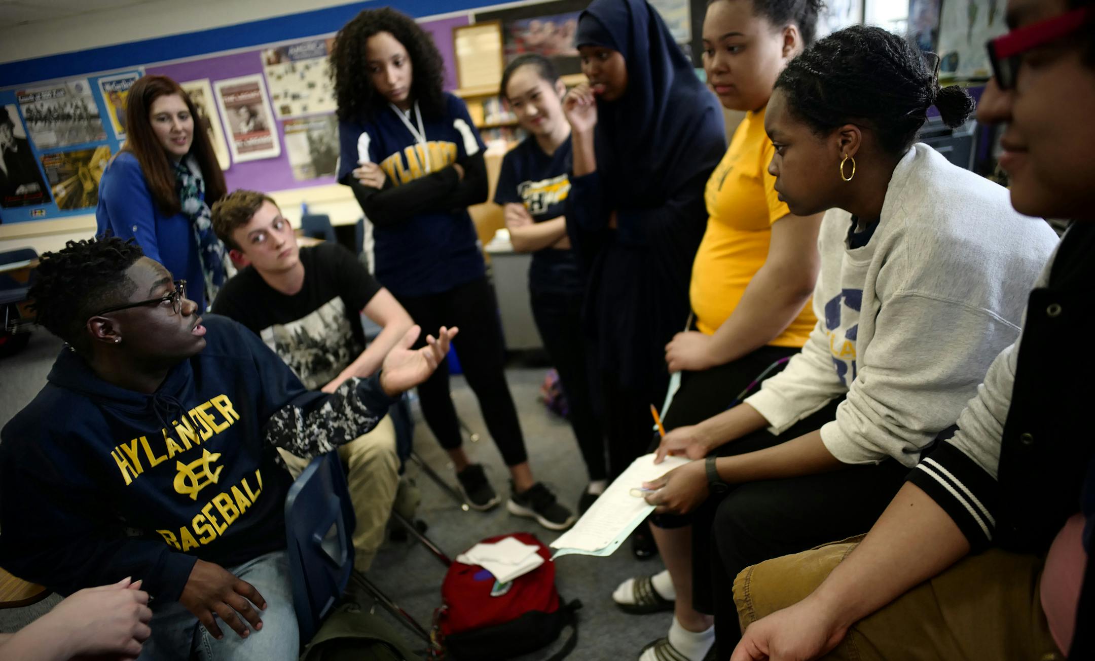 Student Clifton Lovaloy led a huddle with teammates as they prepared to argue in Erin Edwardian Stern's AP History class during a debate on whether the USA lives up to the ideals of the Constitution.] Richard Tsong-Taatarii/rtsong-taatarii@startribune.com