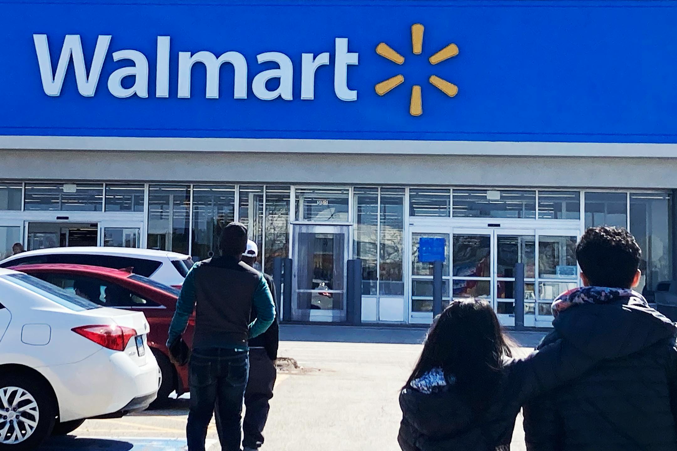 FILE - Shoppers walk to a Walmart in Vernon Hills, Ill., Tuesday, March 28, 2023.