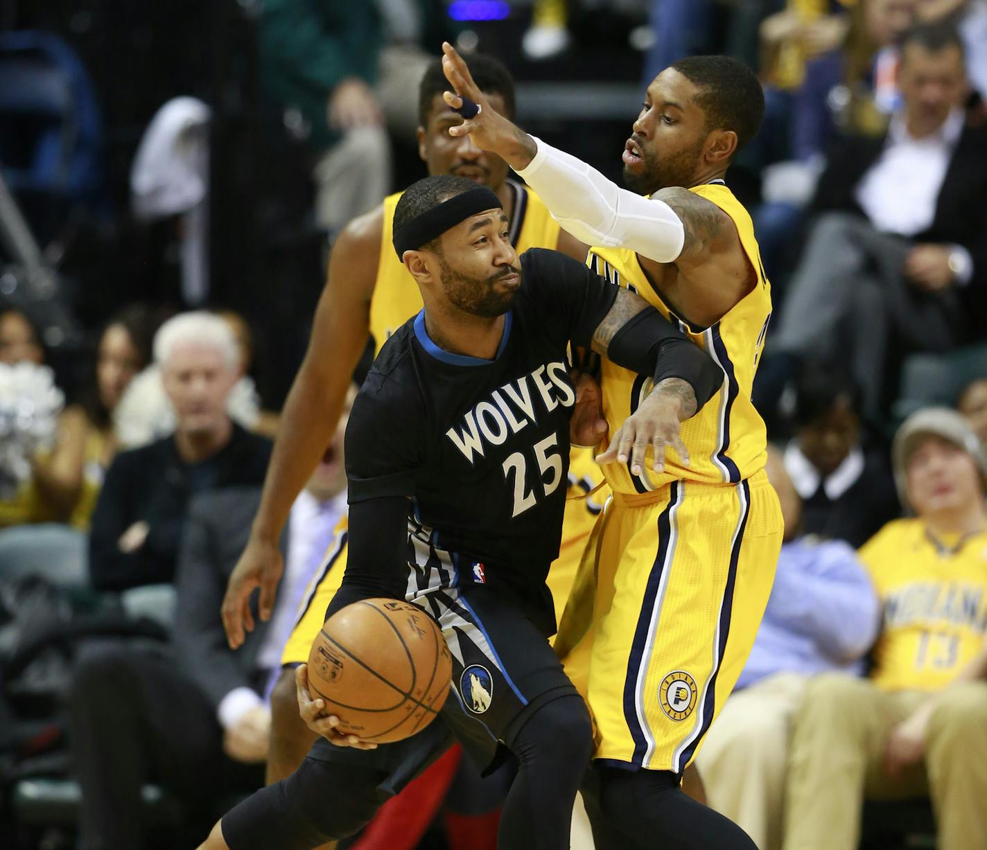 Minnesota Timberwolves guard Mo Williams (25) looks to pass the basketball guarded by Indiana Pacers guard C.J. Watson in the second half of an NBA basketball game in Indianapolis, Tuesday, Jan. 13, 2015. Minnesota won 110-101. (AP Photo/R Brent Smith)