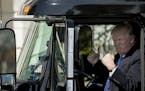 President Donald Trump gestures while sitting in an 18-wheeler truck while meeting with truckers and CEOs regarding healthcare on the South Lawn of th