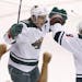The Wild's Zach Parise (left) celebrated his empty-net goal against the Phoenix Coyotes with teammate Mikko Koivu on Saturday. The Wild defeated the C