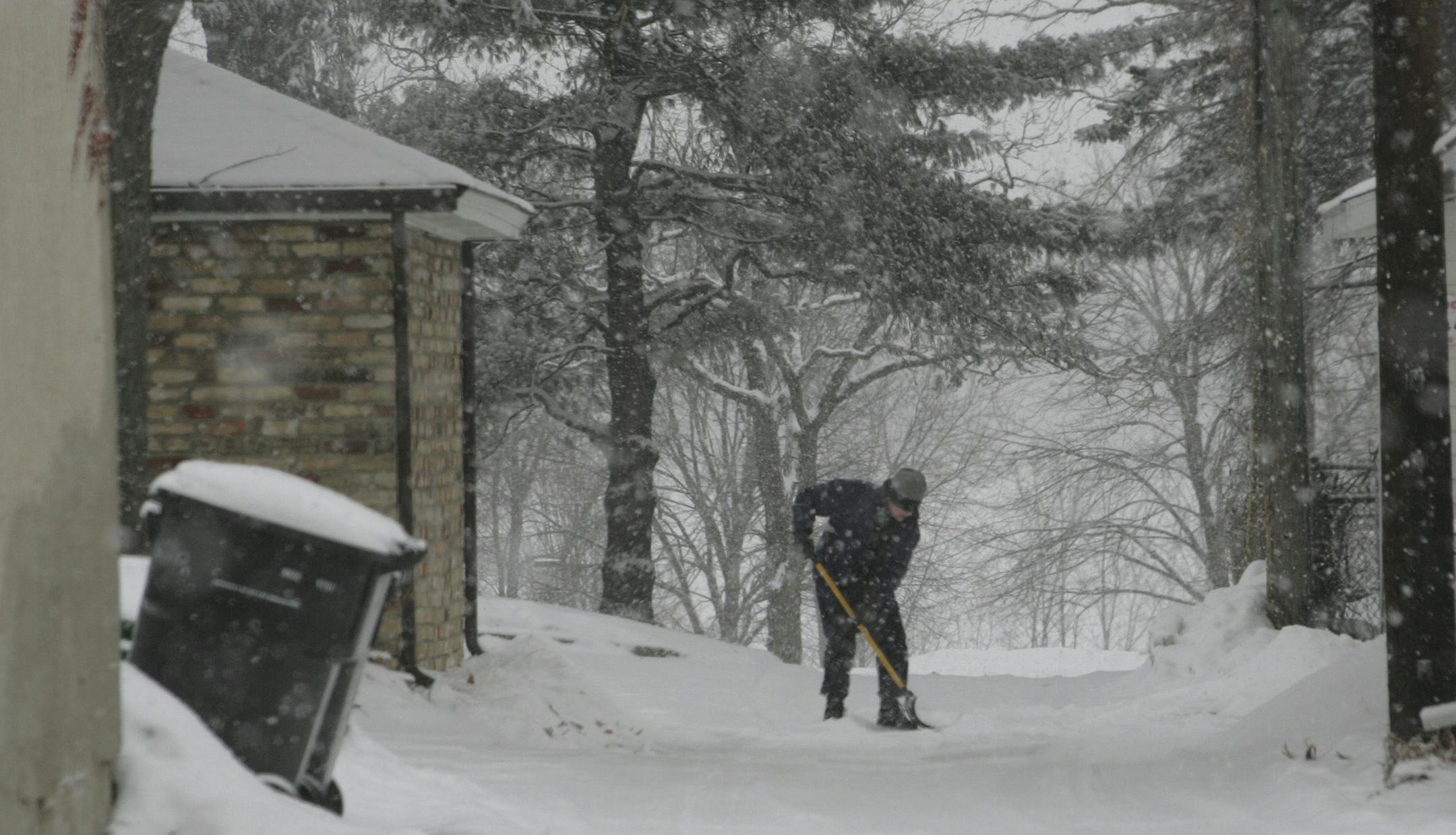 A south Minneapolis resident shovels the snow from her driveway Tuesday, Feb. 6, 2007, in Minneapolis, Minn. Temperatures dropped below zero in Minnesota on Saturday morning, and it was still frigid in northeastern Minnesota early Tuesday, including 31 below zero in Cook, the National Weather Service reported.