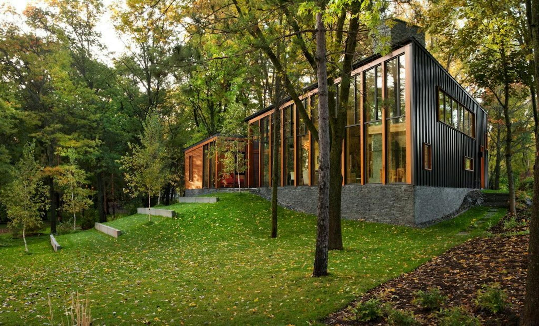 Lake side glass house is clad in black metal, by Tim Alt, Altus Architecture + Design.