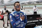 Bubba Wallace stood for the National Anthem before a race on June 14 at Homestead, Fla.