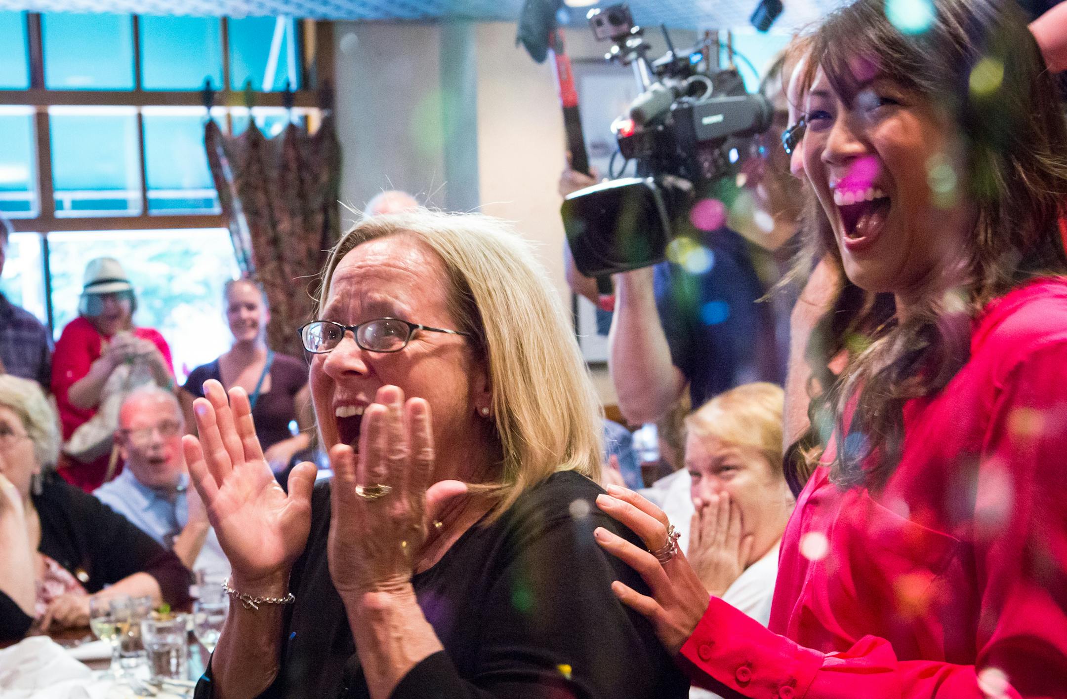 HGTV&#x201a;&#xc4;&#xf4;s Chi-Lan Lieu (Right) surprises Peggy Walker of River Falls, Wisconsin,(LEFT) with the news that she is the winner of the HGTV Smart Home. Giveaway grand prize package, valued at over $900,000 features a stunning eco-friendly, high-tech home near the beach, a 2013 GMC&#xac;&#xc6; Terrain Denali&#xac;&#xc6; and a check for $100,000.