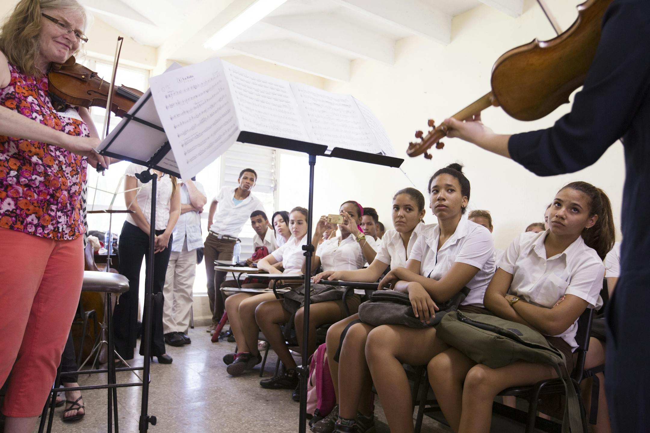Minnesota Orchestra violin players Jean DeVere, left, and Angelia Cho, right, play for students at the Escuela Nacional de Musica in Havana, Cuba on Thursday, May 14, 2015.