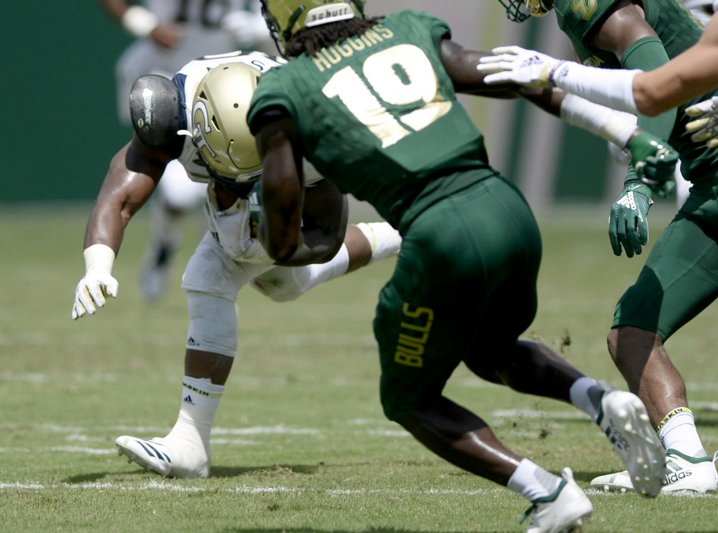 Georgia Tech running back KirVonte Benson (30) runs the ball during the first quarter of an NCAA football game against the South Florida Bulls Saturday, Sept. 8, 2018, in Tampa, Fla. Benson would leave the game after being injured on this play. (AP Photo/Jason Behnken)