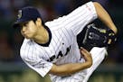 FILE - In this Nov. 19, 2015, file photo, Japan's starter Shohei Ohtani pitches against South Korea during the first inning of their semifinal game at