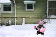 Roselyn Silvestre 2, helped shovel snow in front of her home along Penn Avenue after Saturdays blizzard Sunday April 15, 2018 in Minneapolis, MN. JERR
