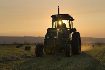 Jack Wheatley, owner of Level Best Ranch and Anderson Hay Elevators, baled hay on his farm on Saturday, August 22, 2015, in Thorp, Wash.