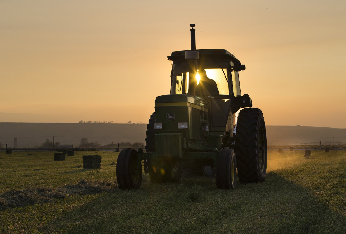 Jack Wheatley, owner of Level Best Ranch and Anderson Hay Elevators, baled hay on his farm on Saturday, August 22, 2015, in Thorp, Wash.