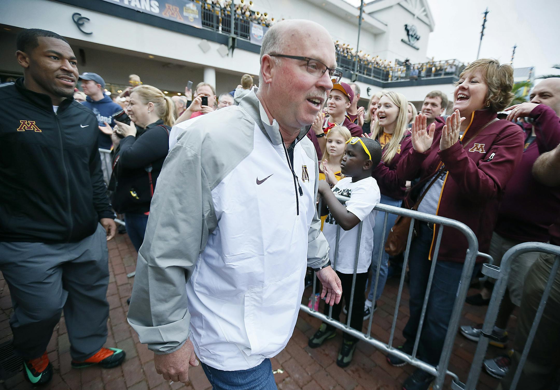 Minnesota's head coach Jerry Kill made his way to the stage followed by running back David Cobb for a team pep rally at the Buffalo Wild Wings Citrus Bowl Pep Rally, Wednesday, December 31, 2014 in Orlando, FL. ] (ELIZABETH FLORES/STAR TRIBUNE) ELIZABETH FLORES • eflores@startribune.com