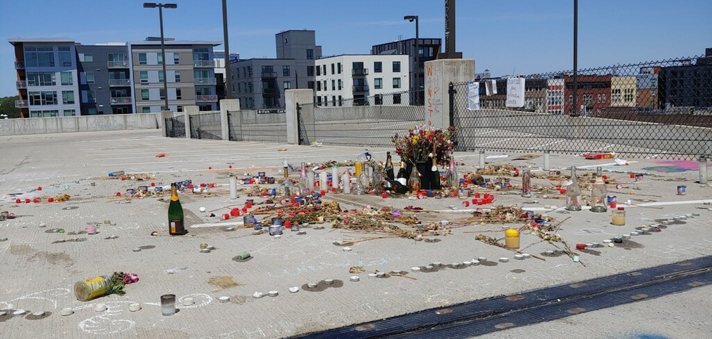 A memorial has sprung up on the fifth floor of the parking garage at Seven Points (formerly Calhoun Square), where Winston Smith was killed June 3 by a federal law enforcement task force. (John Reinan/Star Tribune)