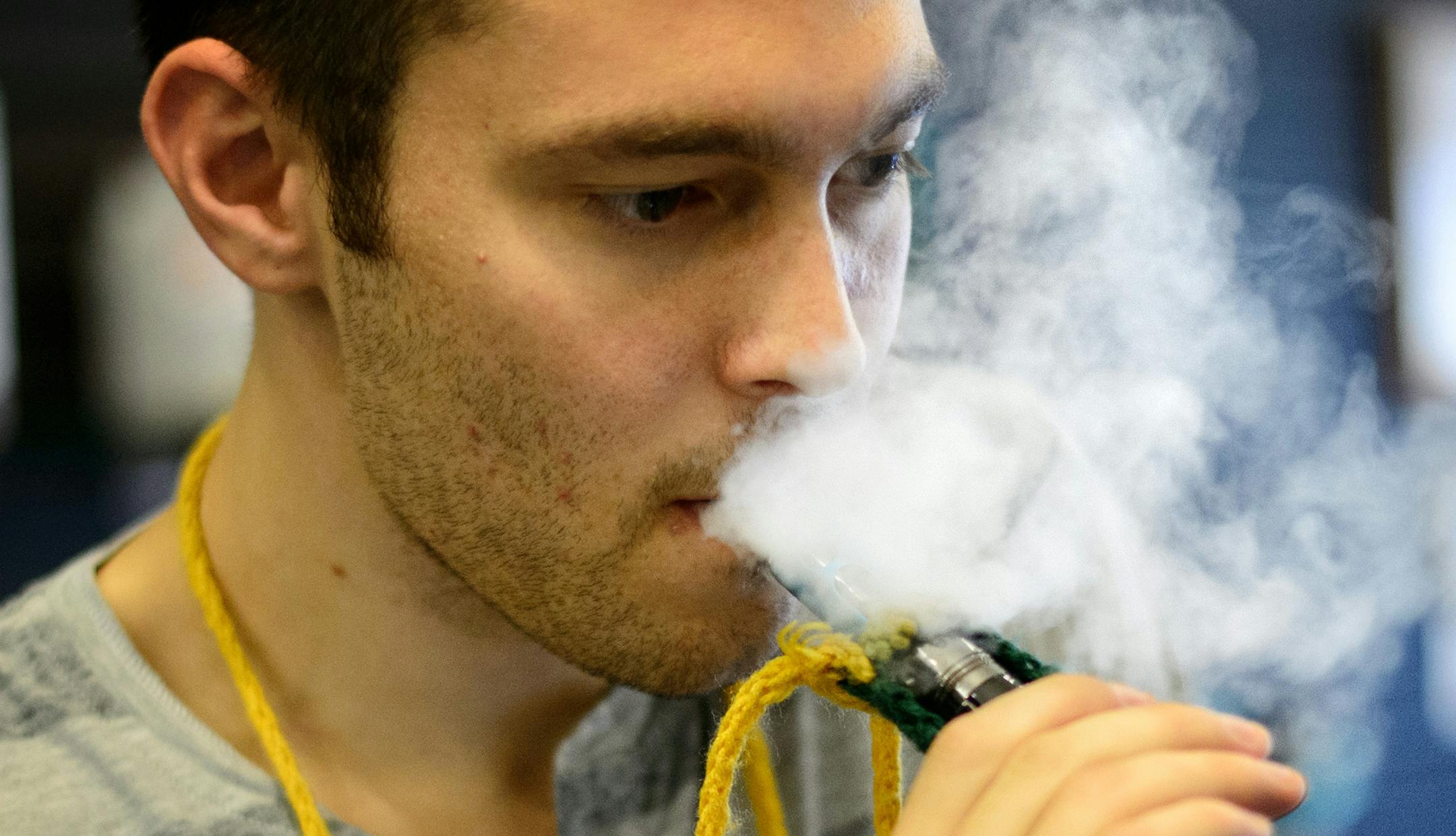 E-cigarettes emit a mild vapor that dissipates quickly. Uptown Vapor Shop employee Ryan Comings puffed as he helped a customer. Tuesday, September 10, 2013 ] GLEN STUBBE * gstubbe@startribune.com