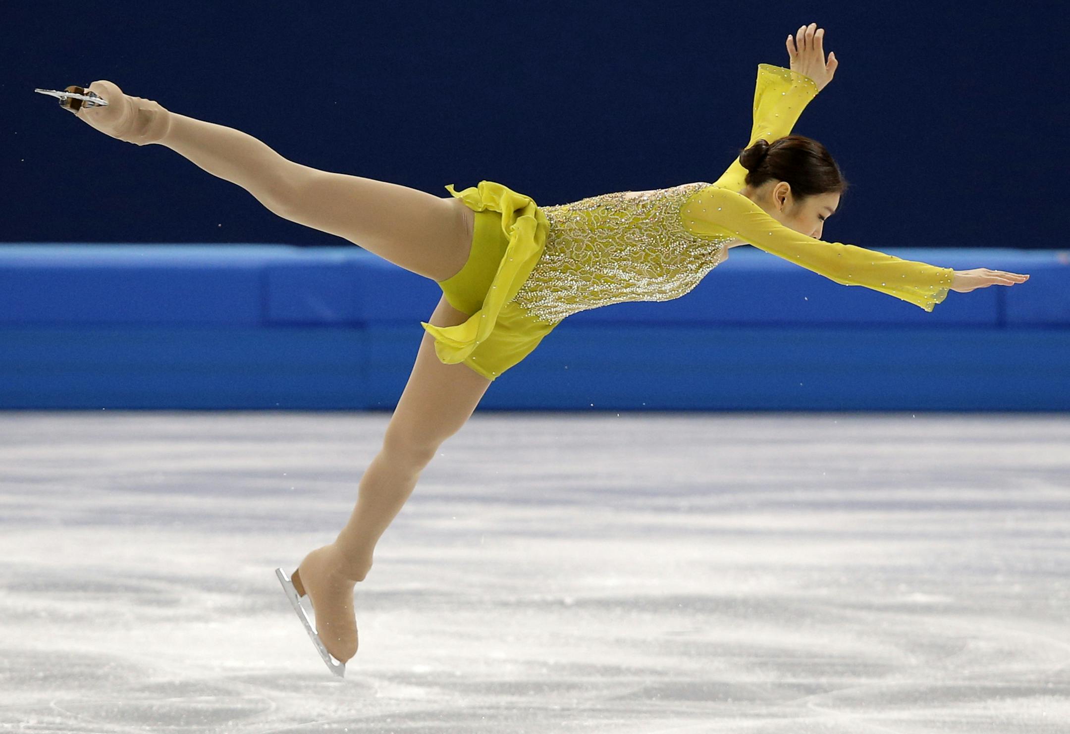 Yuna Kim of South Korea competes in the women's short program figure skating competition at the Iceberg Skating Palace during the 2014 Winter Olympics, Wednesday, Feb. 19, 2014, in Sochi, Russia. (AP Photo/Vadim Ghirda)
