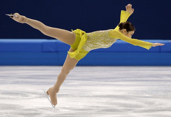 Yuna Kim of South Korea competes in the women's short program figure skating competition at the Iceberg Skating Palace during the 2014 Winter Olympics