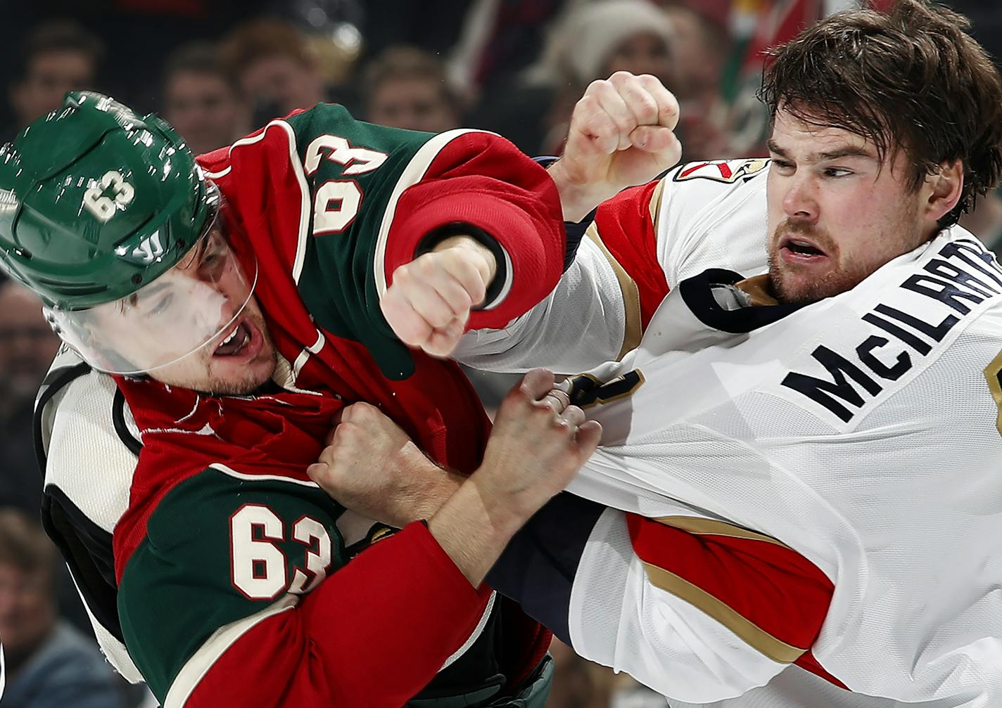 Kurtis Gabriel (63) and Dylan Mcilrath (8) fought in the first period during Tuesday night's game. ] CARLOS GONZALEZ cgonzalez@startribune.com - December 13, 2016, St. Paul, Minnesota, NHL Hockey, Xcel Energy Center, Minnesota Wild vs. Florida Panthers