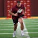 Australian born offensive tackle and former Gopher player Daniel Faalele ran during a three cone drill during the Gophers annual pro day.