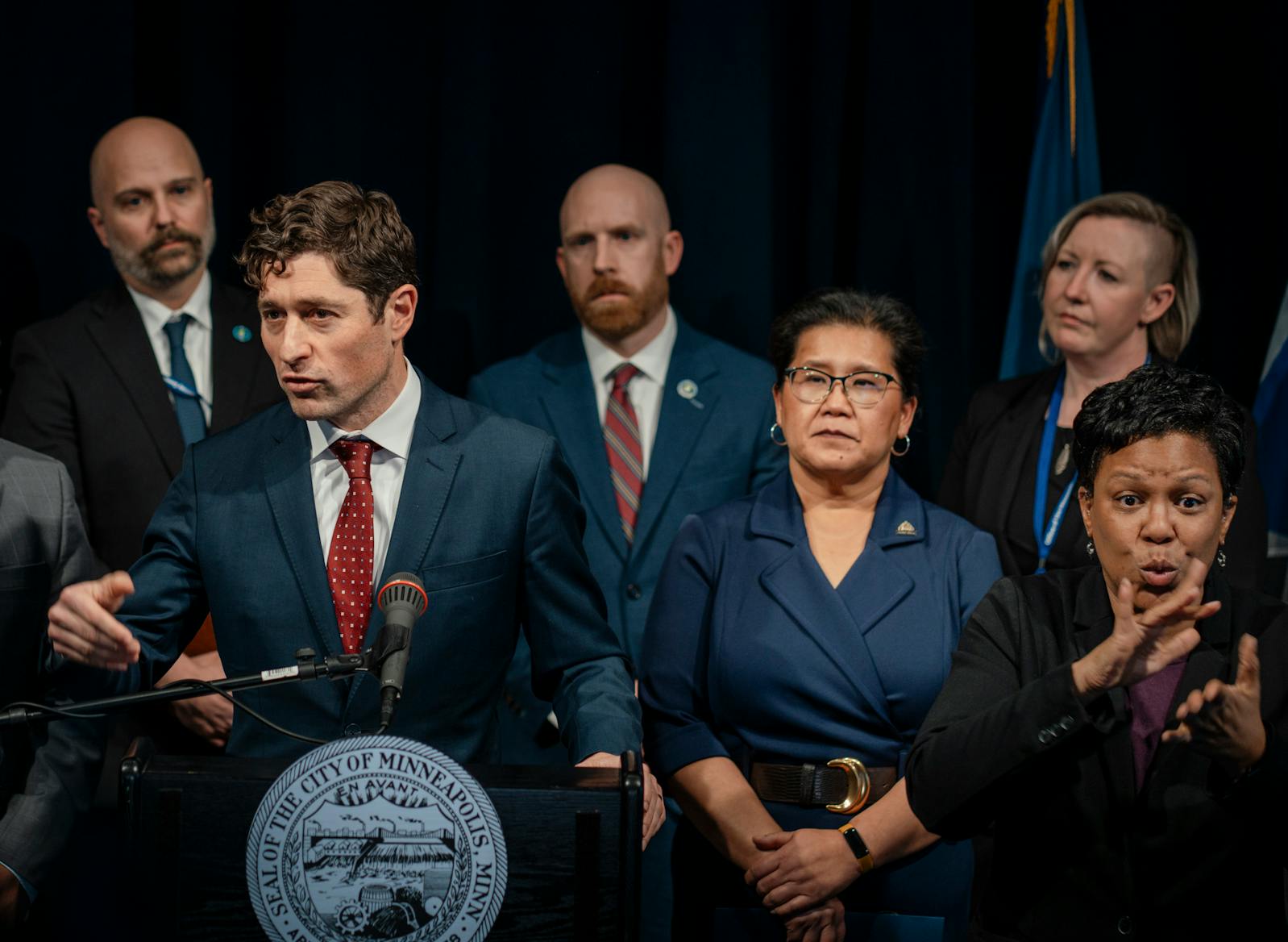 Mayor Jacob Frey of Minneapolis, standing next to St. Paul Mayor Kaohly Her on the right, speaks about federal immigration enforcement at a news conference at City Hall in Minneapolis on Monday, Jan. 12.