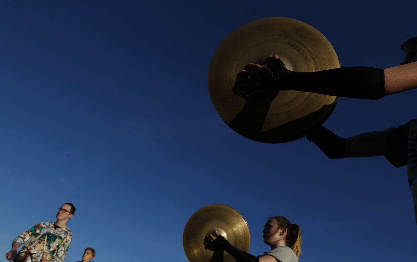 The Eden Prairie Drumline practiced outdoors on the first day of spring. ] CARLOS GONZALEZ &#xef; cgonzalez@startribune.com - March 20, 2017, Eden Prairie, MN, feature on popularity and growing competitive of prep drumlines and color guards, Eden Prairie High School Prep drum line practice