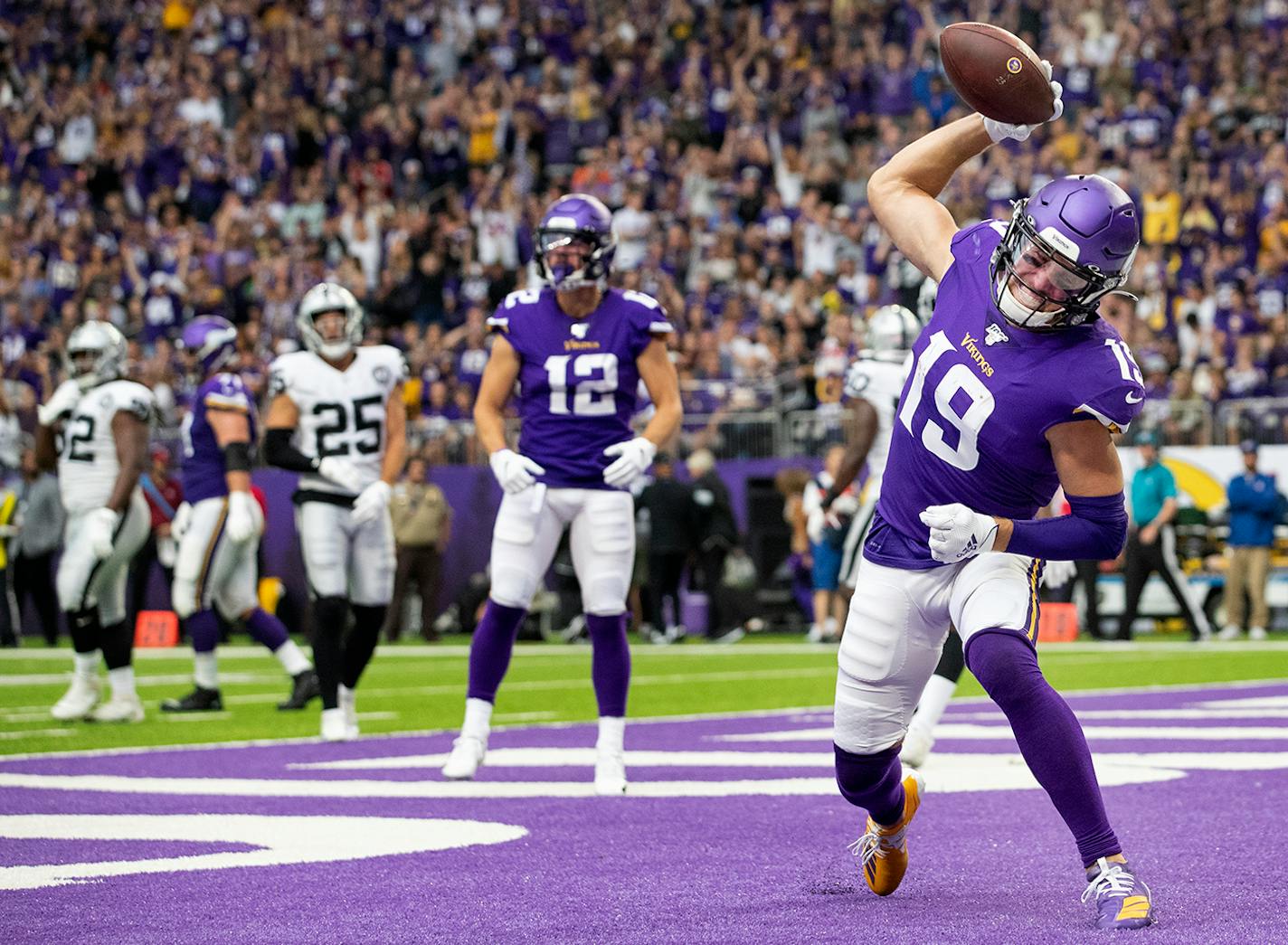 Minnesota Vikings receiver Adam Thielen (19) celebrated after scoring a touchdown in the second quarter.