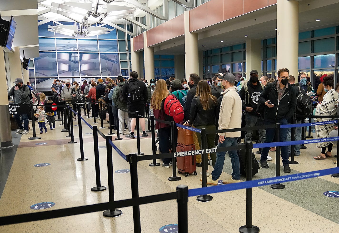 Holiday travelers waited in line to get through TSA security at Terminal 2 of the Minneapolis-St. Paul International Airport on Nov. 22, 2021.