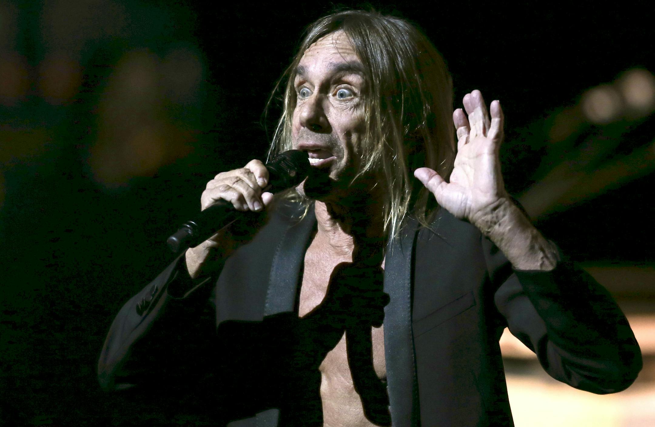 Iggy Pop during his opening song, "Lust for Life" Monday night at Northrop Auditorium. ] JEFF WHEELER Ô jeff.wheeler@startribune.com Punk icon Iggy Pop played Northrop Auditorium on the U of M campus Monday night, April 4, 2016. ORG XMIT: MIN1604042203550058