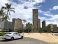 A police officer arrived to tell people to leave Waikiki Beach in Honolulu on March 28, 2020.