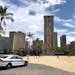 A police officer arrived to tell people to leave Waikiki Beach in Honolulu on March 28, 2020.