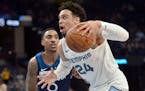 Grizzlies guard Dillon Brooks, who scored a game-high 28 points, drove past Timberwolves guard Jeff Teague during the second half Tuesday.