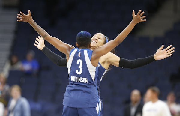 Minnesota Lynx players Maya Moore (23) and Lynx Danielle Robinson (3) celebrated after a game earlier this season. The Lynx defeated Phoenix on Friday