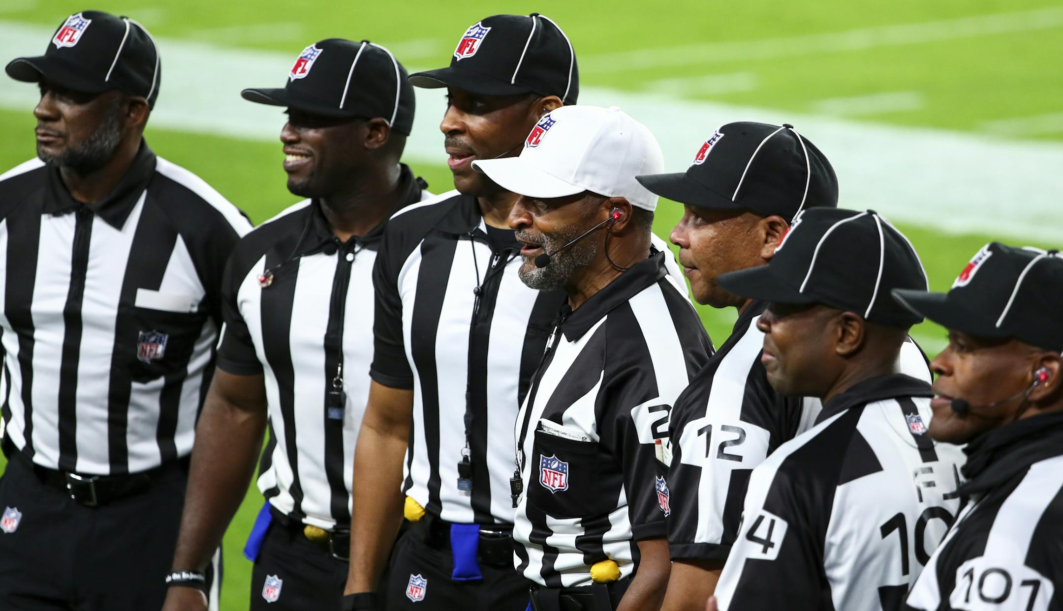 The officials for Monday night's game, led by referee Jerome Boger, center, lined up before they made history as the NFL's first officiating crew entirely of Black men.