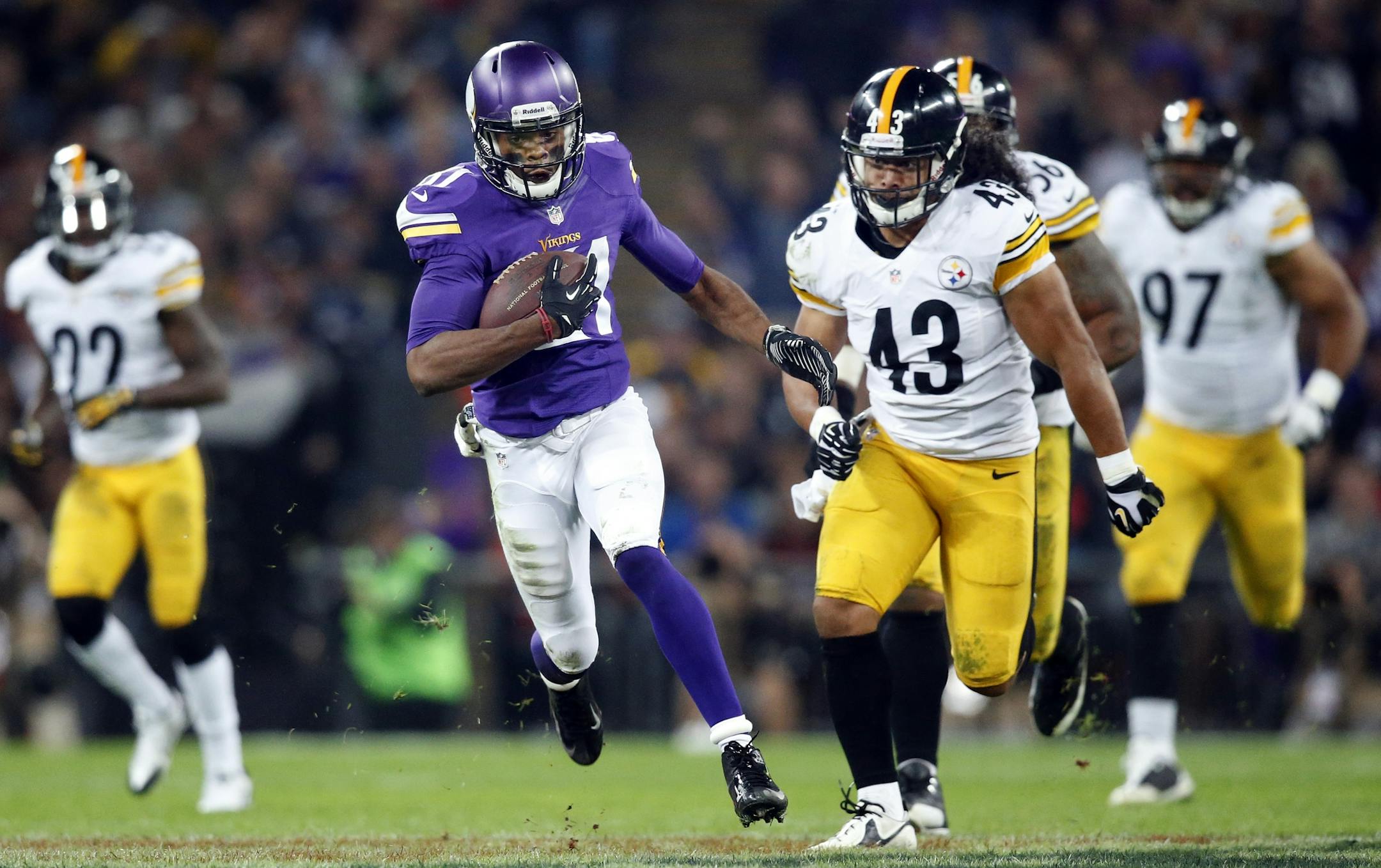 Minnesota Vikings receiver Jerome Simpson (81) was chased by Troy Polamalu (43) after a catch in third quarter. Minnesota beat Pittsburgh by a final score of 34-27.