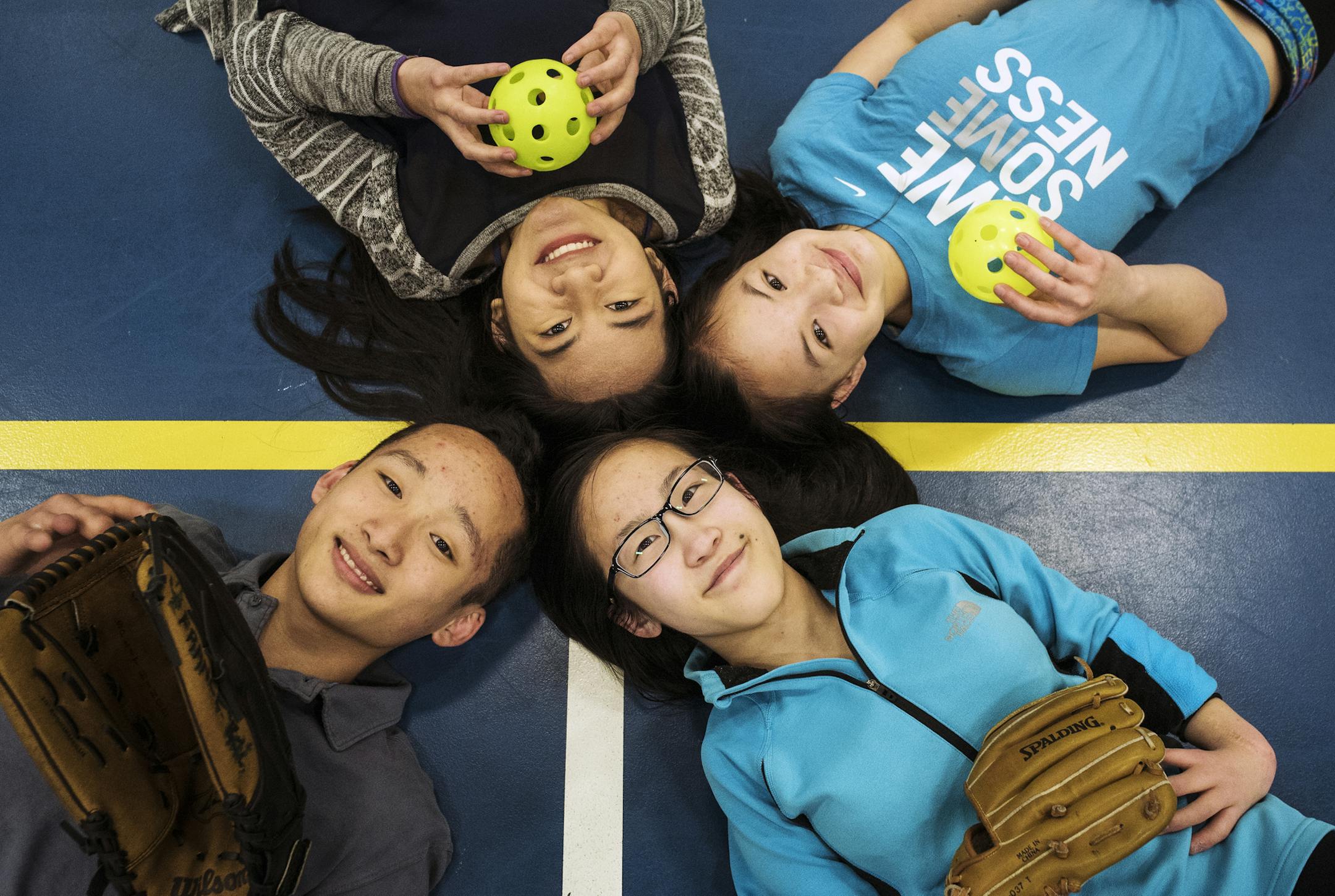 Meet the France family: John and Susan France’s four adopted children are leaders on Anoka-Hennepin’s defending state champion adapted softball team. Clockwise from upper left: Mia, 16, junior; Stevey, 15, freshman; Hana, 18, senior; Kai, 16, junior.