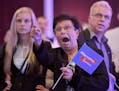 Guests at an Alternative for Germany party, AfD, election party react to the first projections for the German election in Erfurt, Germany, Sunday, Sep