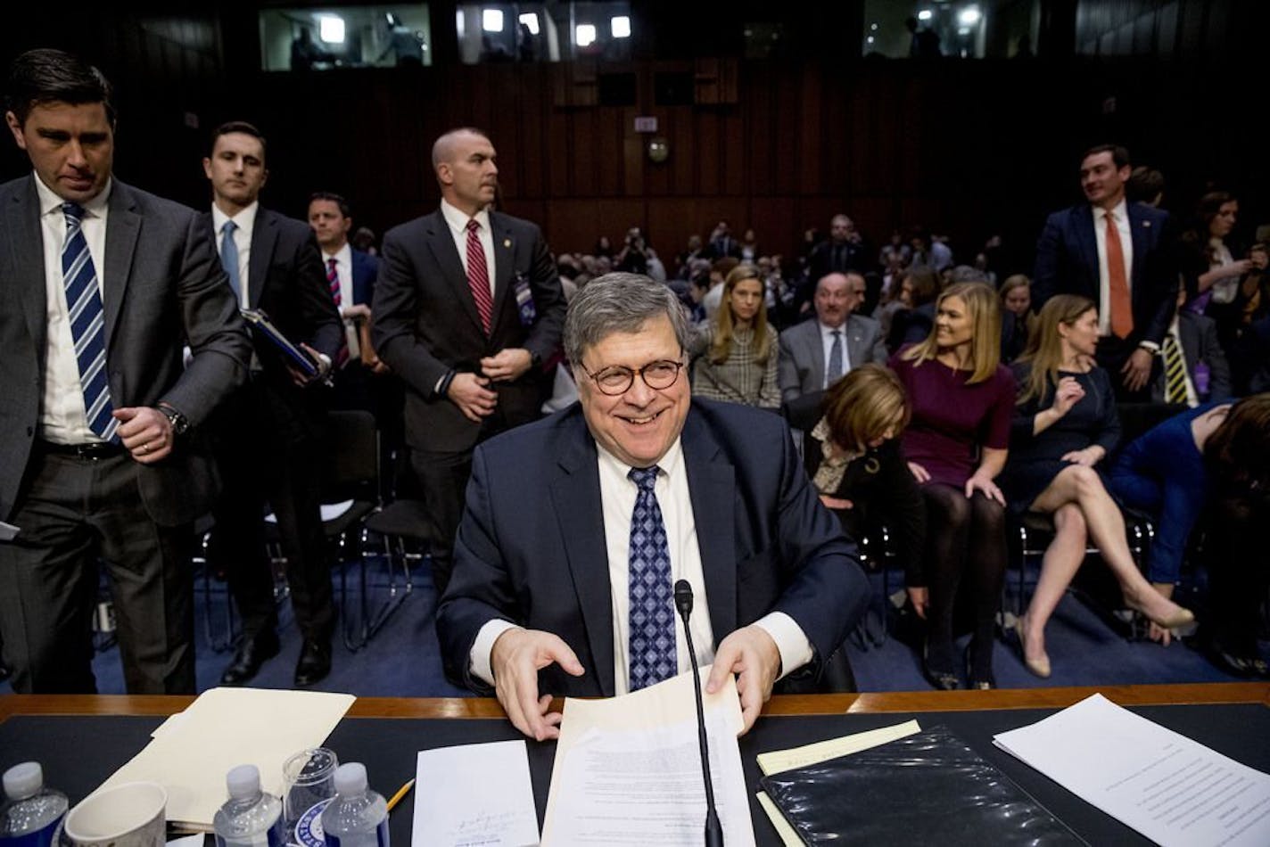 Attorney General nominee William Barr collects his papers as he departs for a lunch break during a Senate Judiciary Committee hearing on Capitol Hill in Washington, Tuesday, Jan. 15, 2019.