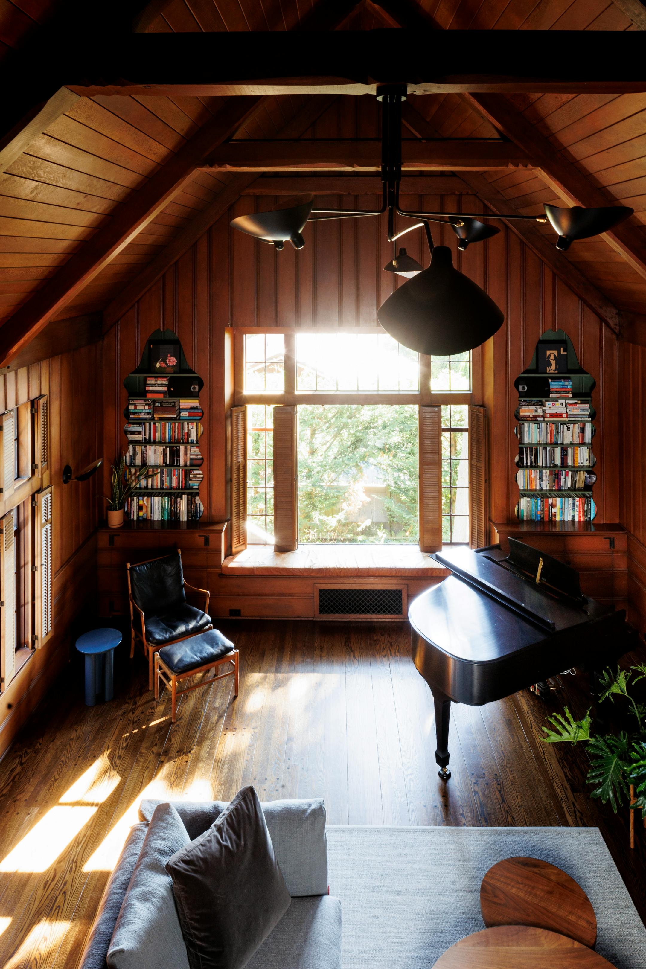 Douglas fir walls in the vaulted living room of a home built in 1933, now designated as a historical landmark in Seattle's Ballard neighborhood, on Aug. 3. 2023. New owners found a way to marry a contemporary kitchen extension to the Scandinavian vernacular architecture of the house, built by a Norwegian sea captain as a replica of his childhood home. (Brooke Fitts/The New York Times)