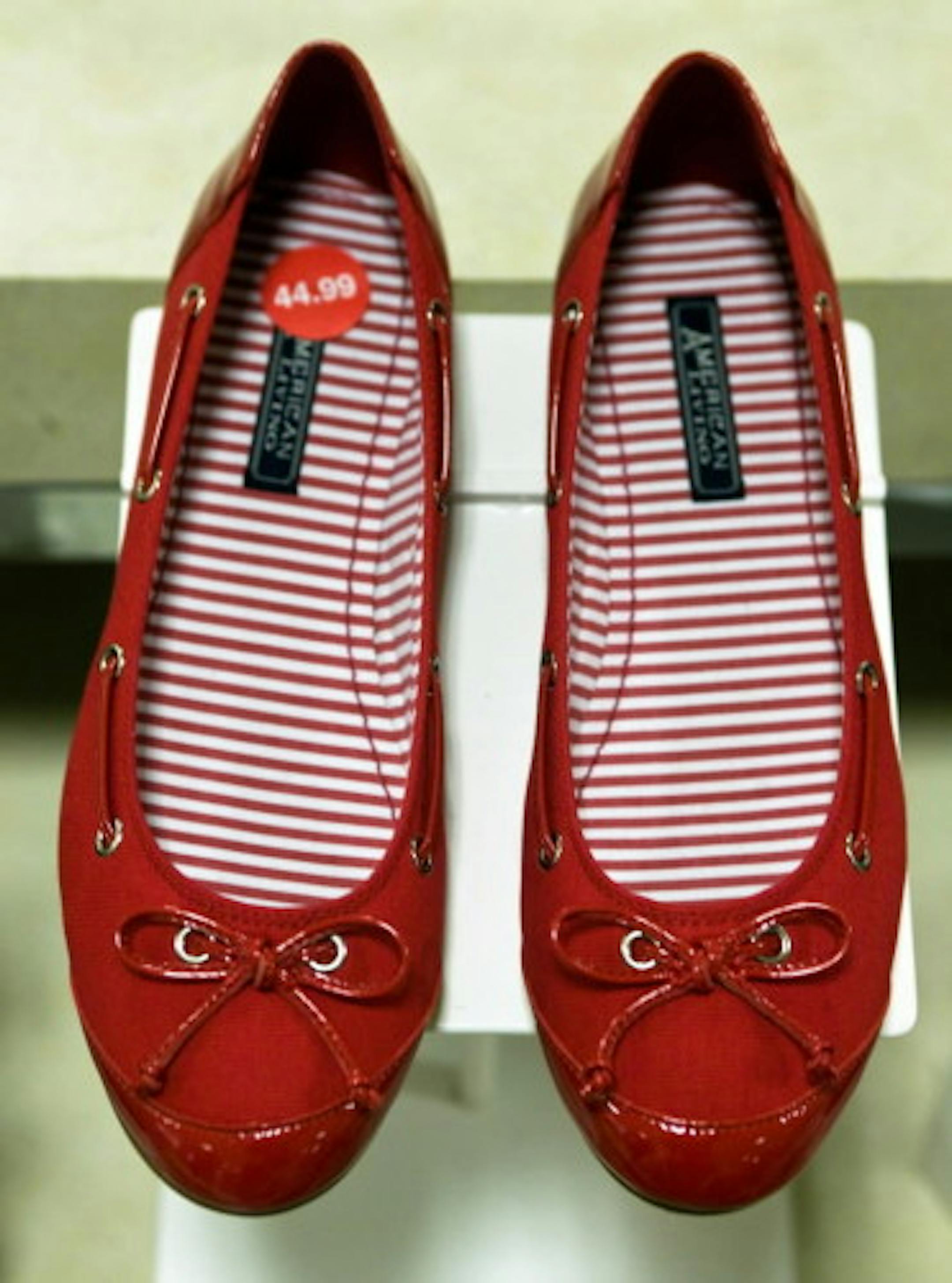 Ralph Lauren shoes at the J.C. Penny store in Paramus, N.J., in February 2008. Over the next year, an unusually large group of famous clothing designers, motivated by lucrative deals, plan to shift their retail allegiances, in many cases abandoning stores and customers who have supported them for years.