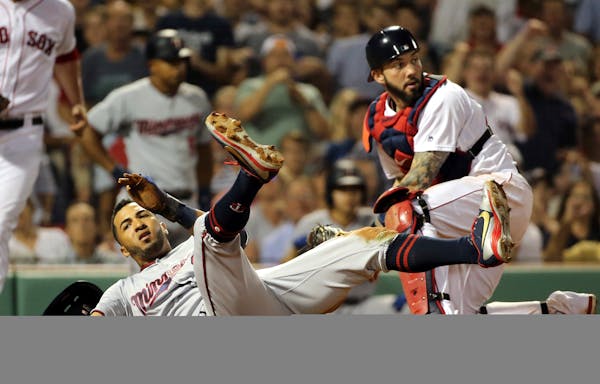 Eddie Rosario was tagged out by Red Sox catcher Blake Swihart