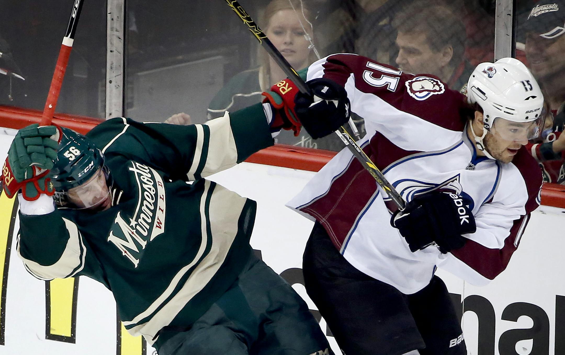Erik Haula (56) and PA Parenteau (15) collided in the first period of Game 3.
