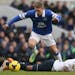 Tottenham's Danny Rose, lies on the ground after being fouled by Everton's Gerard Deulofeu during the English Premier League soccer match between Tott
