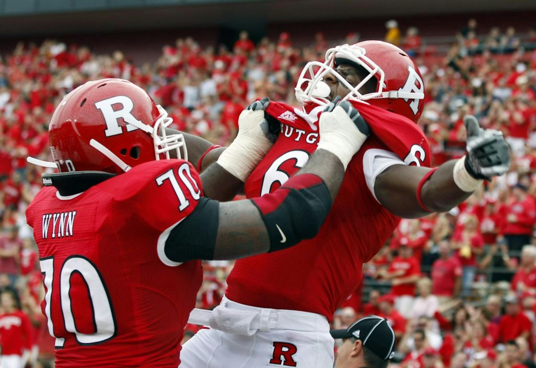 Rutgers wide receiver Mohamed Sanu (6) celebrates a touchdown with offensive lineman Desmond Wynn (70) during the second half of an NCAA college football game against Ohio in Piscataway, N.J., Saturday, Sept. 24, 2011. Rutgers won 38-26.