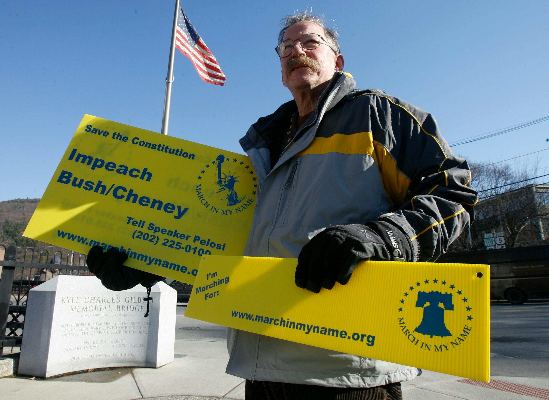 John Nirenberg stands in downtown Brattleboro, Vt., Friday, Nov. 30, 2007. The 60-year-old Brattleboro man is gearing up to walk from Boston to Washington D.C. to urge House Speaker Nancy Pelosi to get Congress to begin debating the impeachment of President Bush and Vice President Cheney.