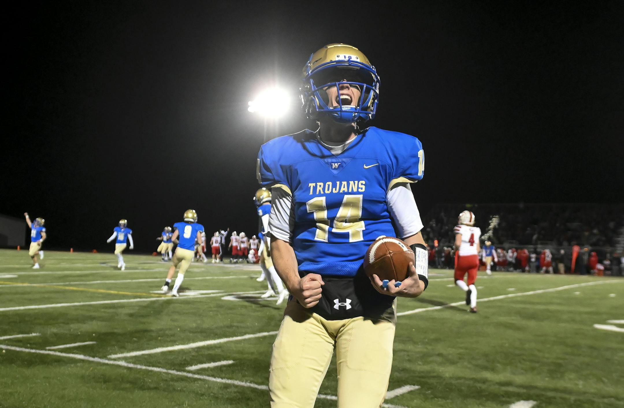 Wayzata quarterback Thomas Schmidt (14) celebrated his team's 38-21 victory over Centennial Friday night. ] Aaron Lavinsky • aaron.lavinsky@startribune.com Wayzata played Centennial in a Class 6A football state quarterfinal game on Friday, Nov. 8, 2019 at Chanhassen High School in Chanhassen, Minn.